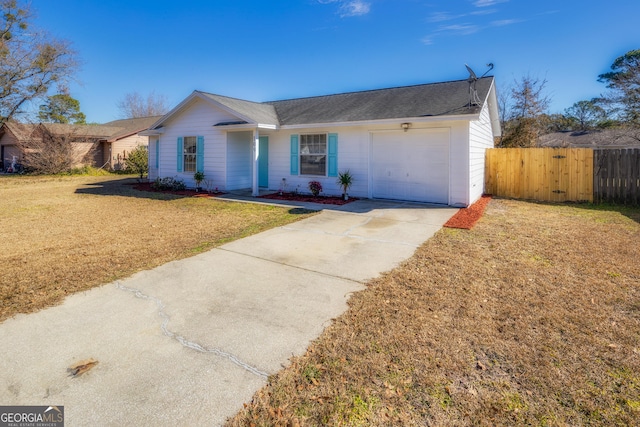 single story home featuring a garage and a front lawn