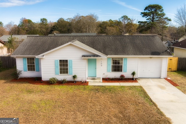 ranch-style house with a garage and a front lawn