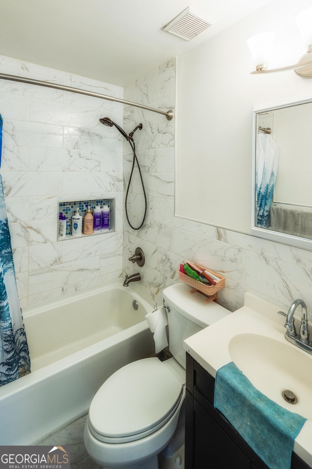 full bathroom featuring shower / bath combination with curtain, vanity, toilet, and tile walls