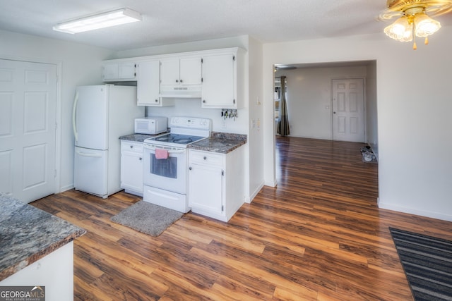 kitchen featuring white cabinetry, dark hardwood / wood-style floors, a textured ceiling, and white appliances