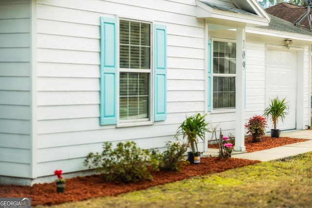 view of side of property featuring a garage