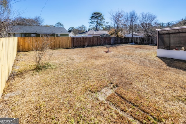 view of yard featuring a sunroom