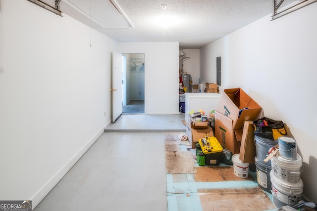 interior space featuring electric water heater, electric panel, and a textured ceiling