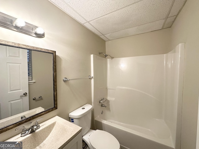 full bathroom with vanity, a paneled ceiling, toilet, and shower / bath combination