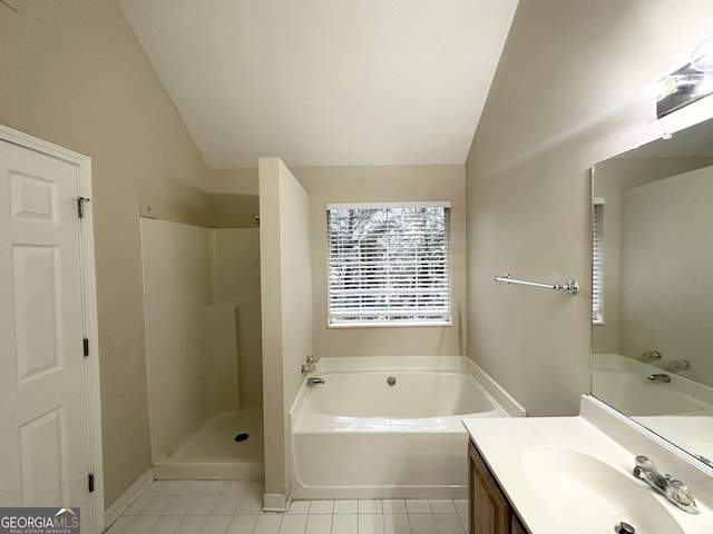 bathroom featuring vanity, vaulted ceiling, tile patterned floors, and shower with separate bathtub