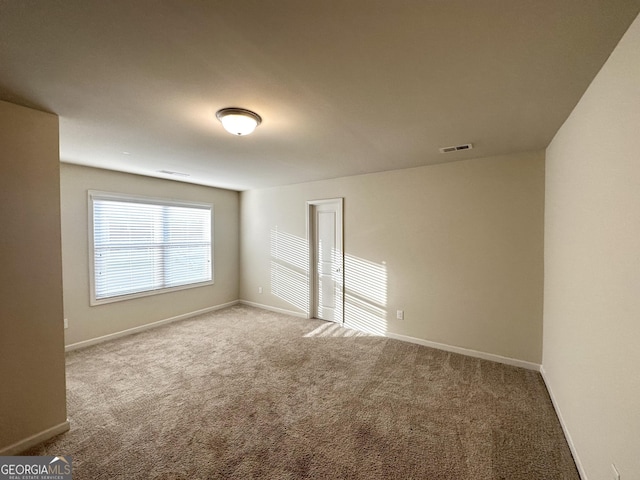 spare room with carpet floors