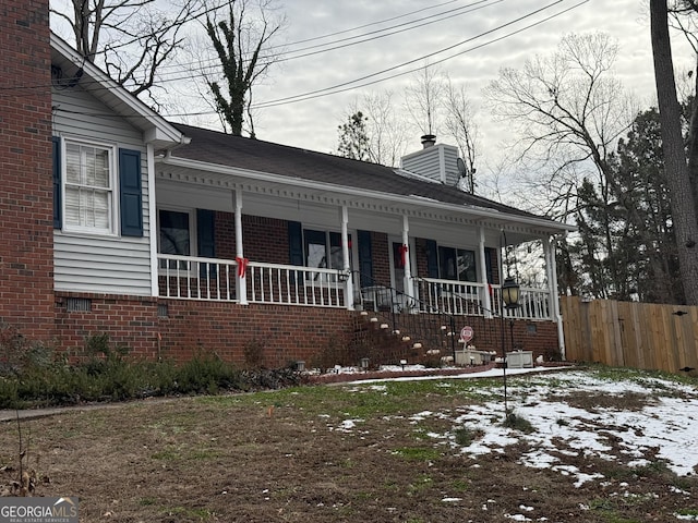 view of front of property featuring a porch and central AC unit