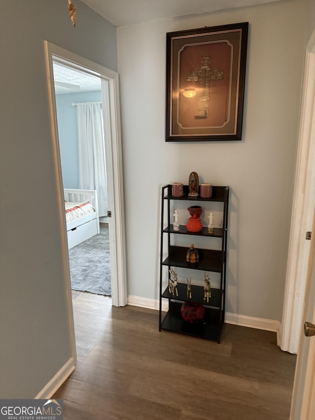 corridor with dark wood-type flooring