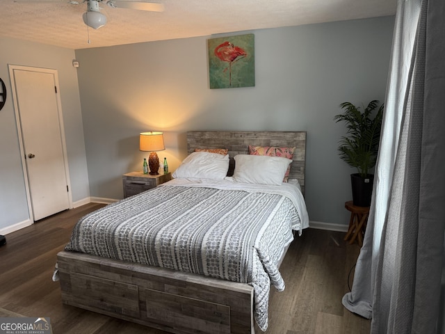 bedroom with ceiling fan and dark hardwood / wood-style floors