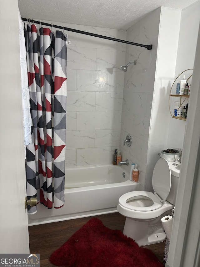 bathroom with wood-type flooring, shower / bathtub combination with curtain, a textured ceiling, and toilet