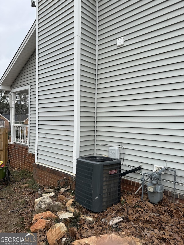 view of side of property featuring central air condition unit