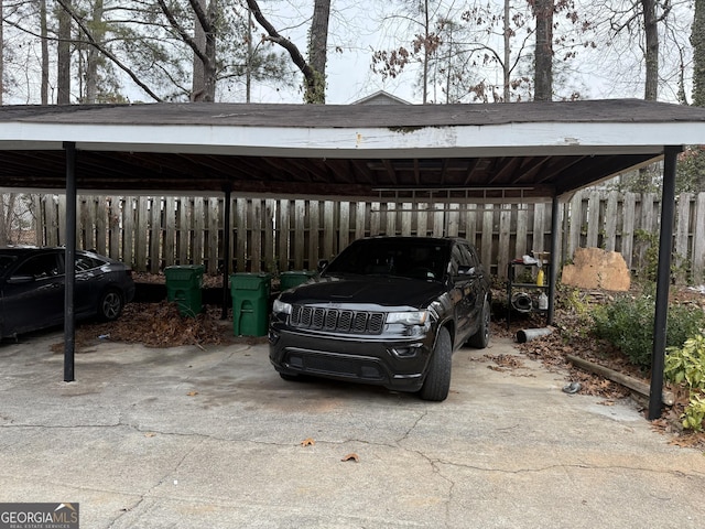 view of parking / parking lot with a carport