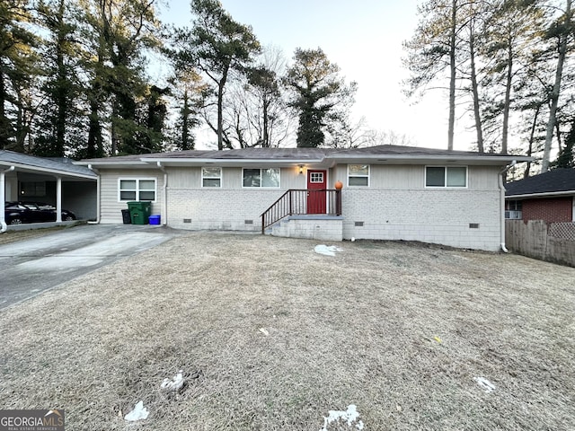 ranch-style home with a carport