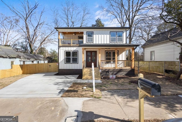 view of front of property with a balcony and covered porch