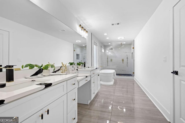 bathroom with vanity and plus walk in shower