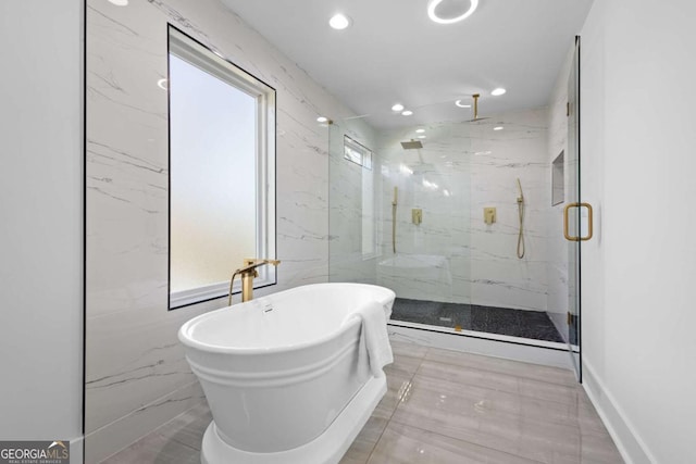 bathroom with shower with separate bathtub