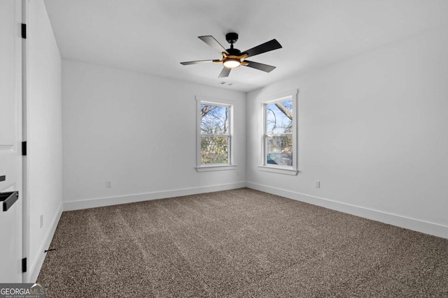 carpeted empty room featuring ceiling fan