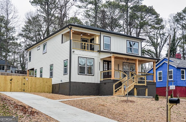 view of front of property featuring a balcony and a porch