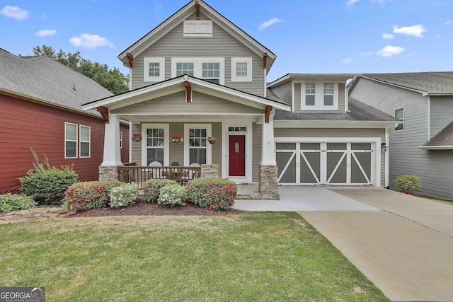 128 Greenview Dr, Newnan, GA 30265 - view of front of house featuring stone siding, driveway, a front yard, and covered porch