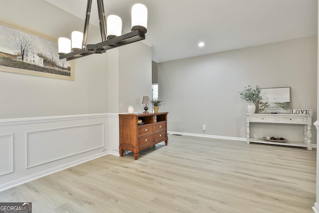 dining space featuring a notable chandelier and light hardwood / wood-style flooring