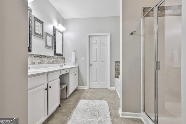 128 Greenview Dr, Newnan, GA 30265 - bathroom with tile patterned flooring, double vanity, a sink, a bath, and a stall shower