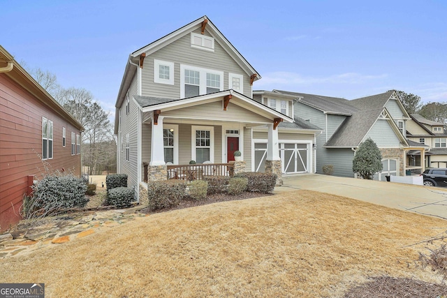 view of front facade featuring a garage and covered porch