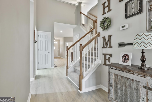 stairs featuring hardwood / wood-style flooring