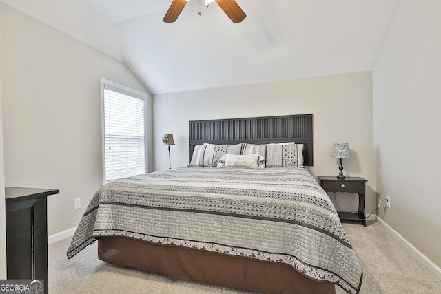 carpeted bedroom featuring lofted ceiling and ceiling fan