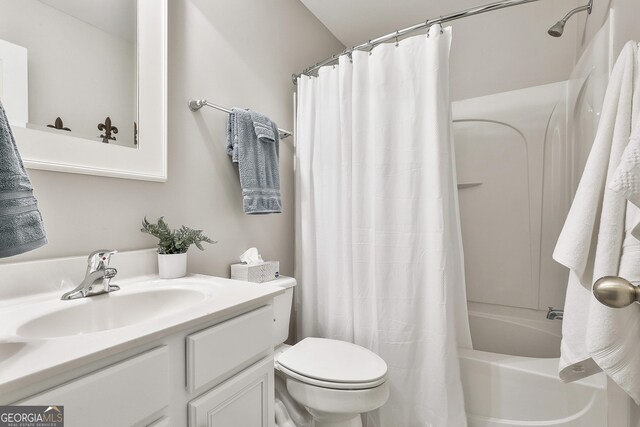 128 Greenview Dr, Newnan, GA 30265 - bathroom featuring toilet, vanity, and shower / bathtub combination with curtain