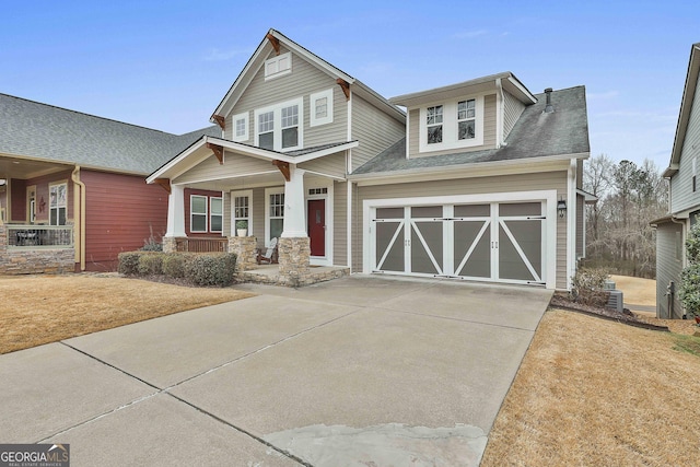 craftsman-style house featuring a garage and covered porch