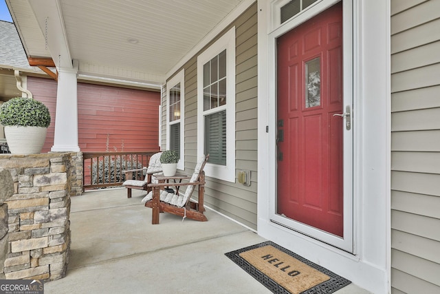 doorway to property with covered porch