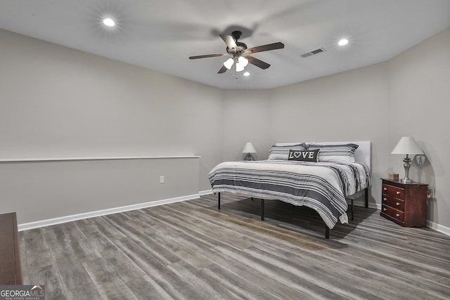 bedroom with hardwood / wood-style flooring and ceiling fan