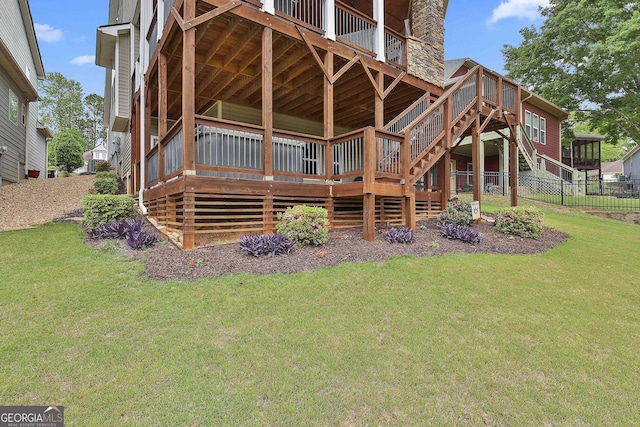 128 Greenview Dr, Newnan, GA 30265 - rear view of house featuring a yard, stairway, fence, and a deck