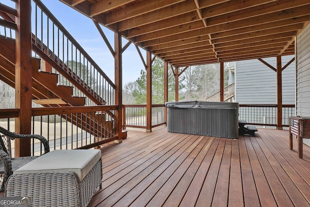 wooden terrace featuring ac unit and a hot tub