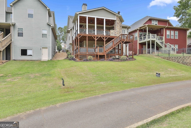 128 Greenview Dr, Newnan, GA 30265 - rear view of house featuring a yard, a chimney, stairs, and fence