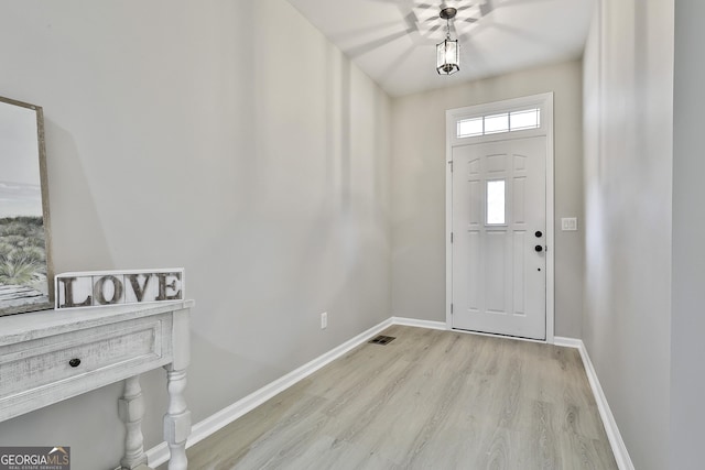 foyer with light hardwood / wood-style floors