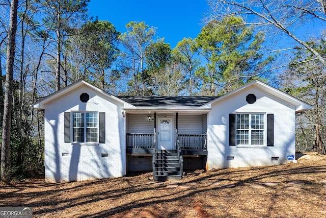 ranch-style home featuring a porch