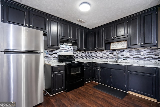 kitchen with stainless steel refrigerator, sink, dark hardwood / wood-style flooring, light stone countertops, and black electric range