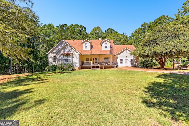 new england style home with a porch and a front yard