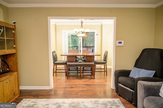 interior space with a notable chandelier, crown molding, and dark hardwood / wood-style floors