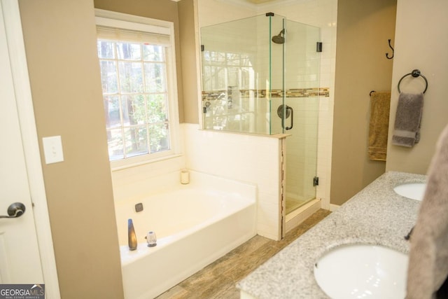 bathroom with vanity, a wealth of natural light, and independent shower and bath