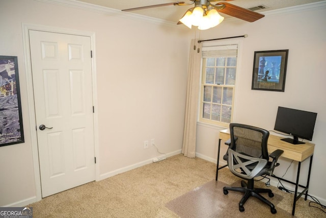 carpeted office space with ornamental molding and ceiling fan