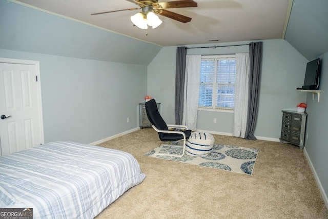 carpeted bedroom featuring vaulted ceiling and ceiling fan