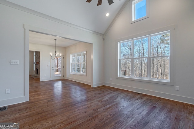 unfurnished living room with ornamental molding, dark hardwood / wood-style floors, ceiling fan with notable chandelier, and high vaulted ceiling