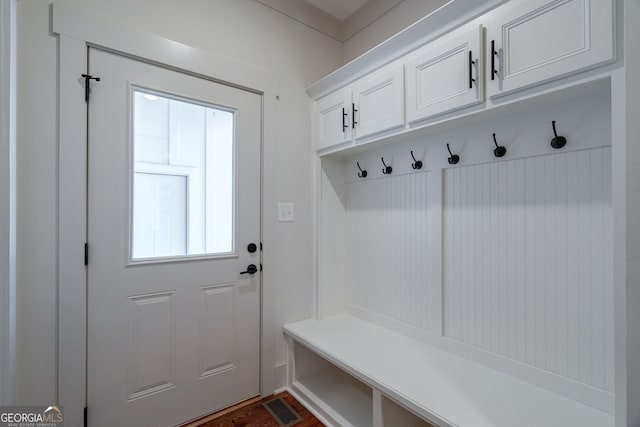 mudroom with dark hardwood / wood-style floors