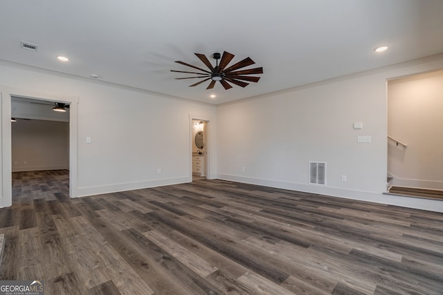 empty room with dark wood-type flooring, ceiling fan, and ornamental molding