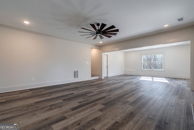 unfurnished room with dark hardwood / wood-style flooring and ceiling fan