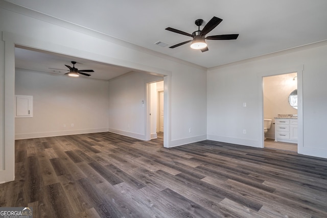 unfurnished room featuring ornamental molding, dark wood-type flooring, and ceiling fan