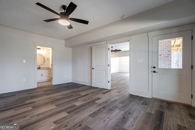 entryway with dark wood-type flooring and ceiling fan