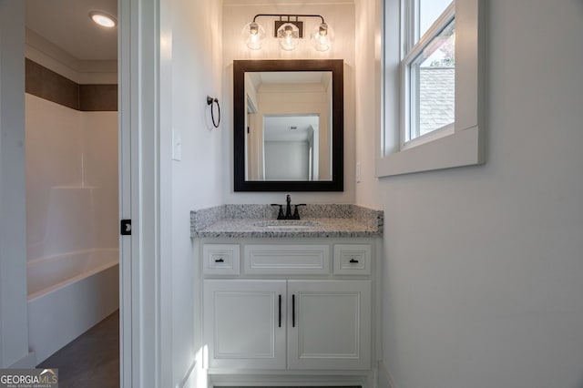 bathroom with vanity and washtub / shower combination